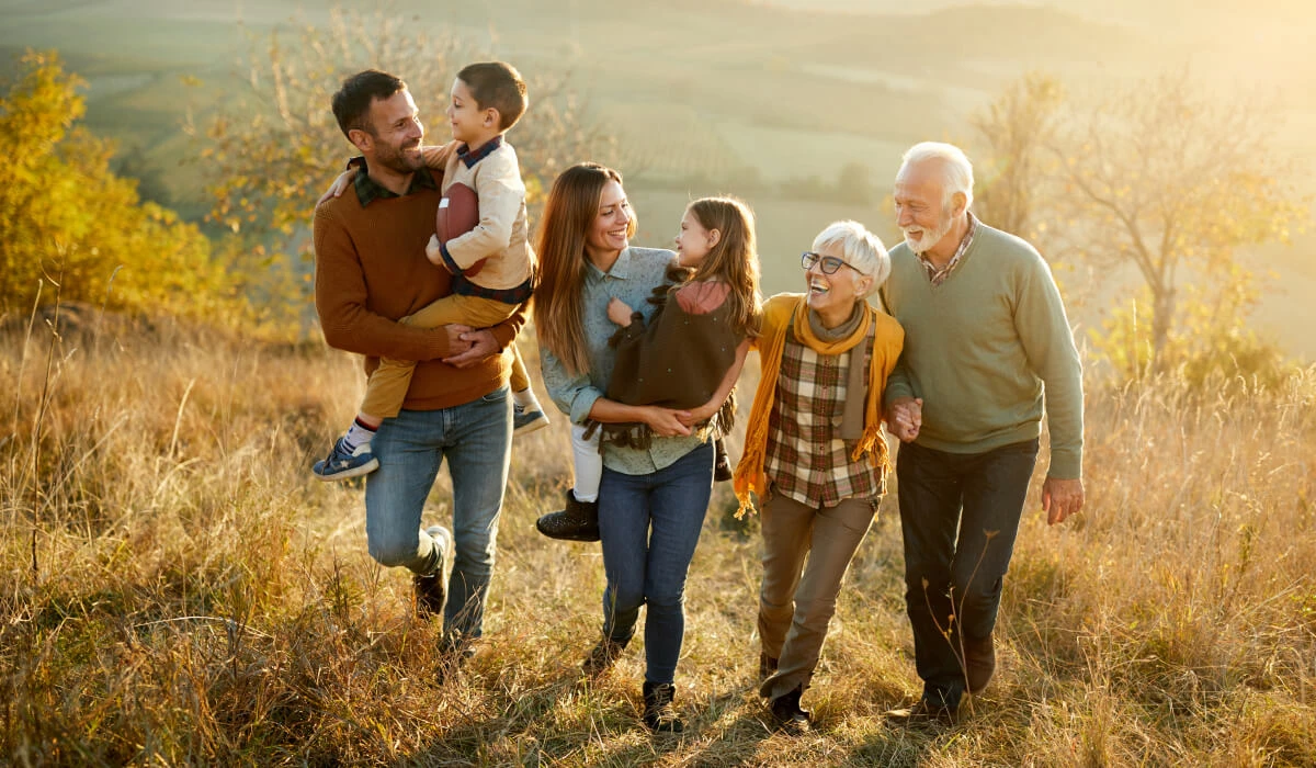 family on country walk in golden sunshine