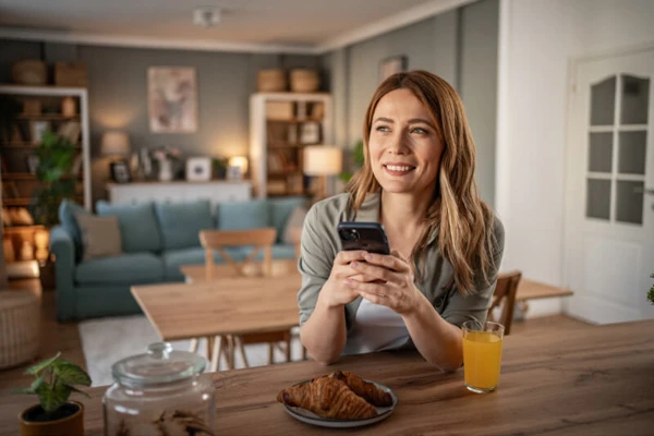 Woman On Cell Phone At Home